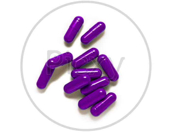 Purple Capsule Pills Isolated On White Background