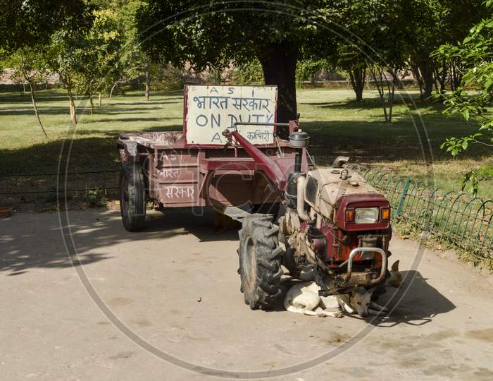 A Vehicle Of Asi Department Of Indian Government For Collective Garbage From Lawn At Old Fort.
