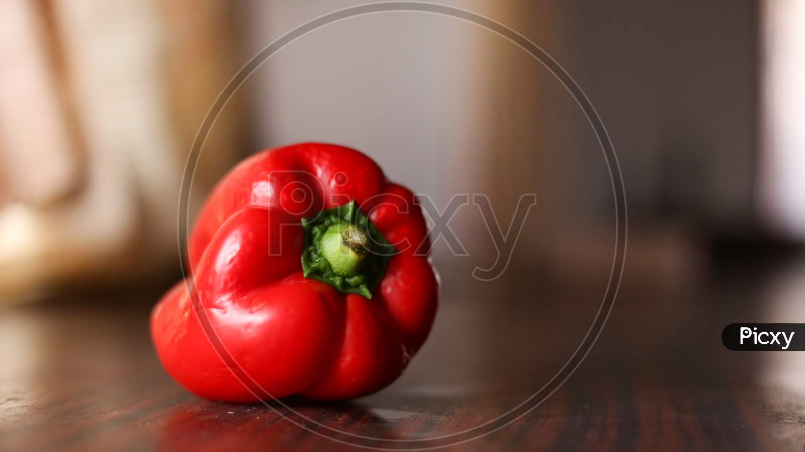 Closeup View Of Red Color Bell Pepper In A Clean Background