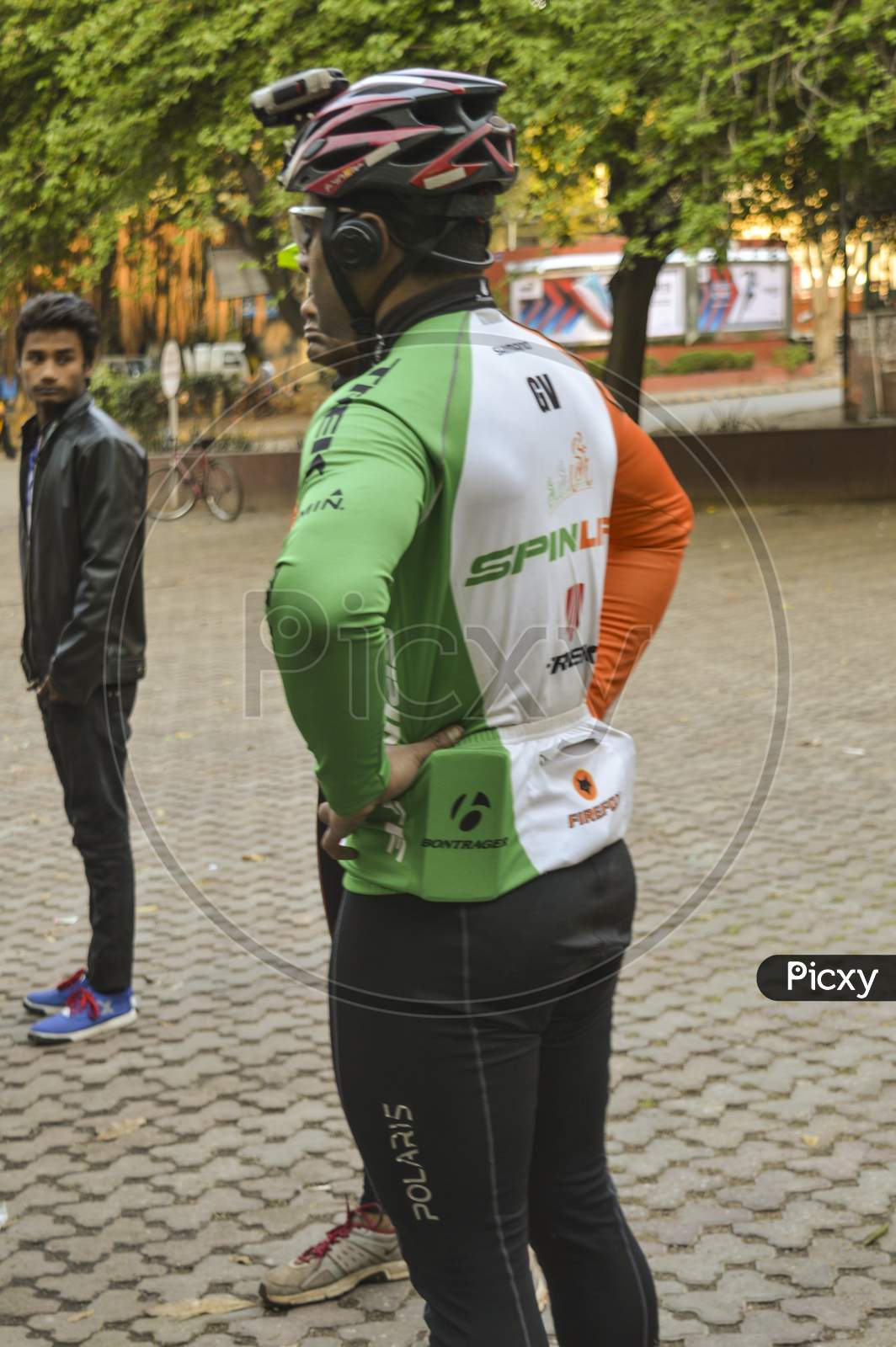 A Cyclist Who Is Wearing Indian Flag Color T-Shirt.