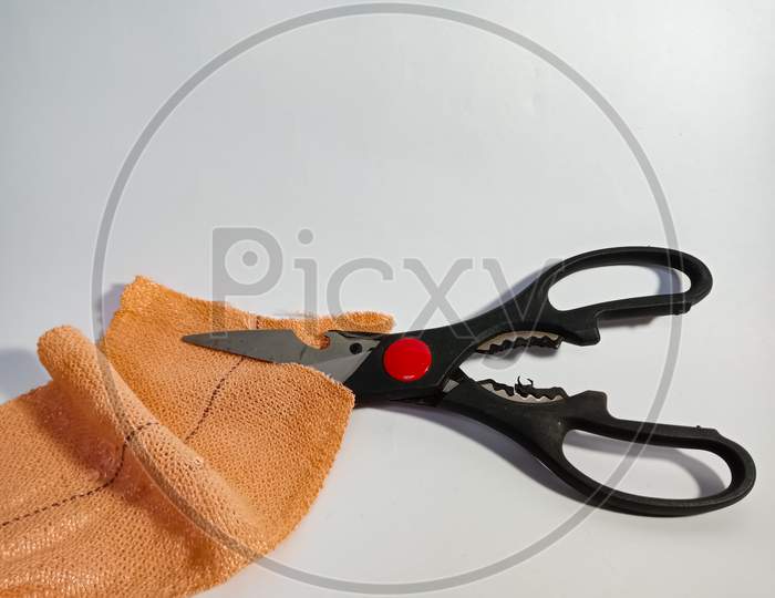 Scissors Cutting Medical Band Isolated On White Background For Marketing And Branding Promotional Purpose Background.