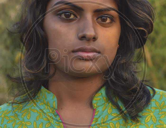 A Indian Girl Poses For Portfolio Shoot At Outside Of Studio.