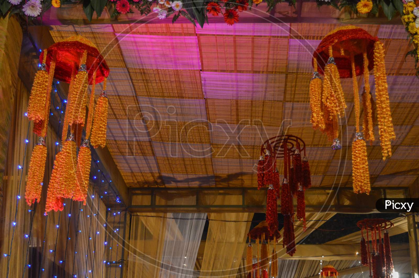 A Beautiful Hanger Decoration In Indian Wedding With Fairy Lights.