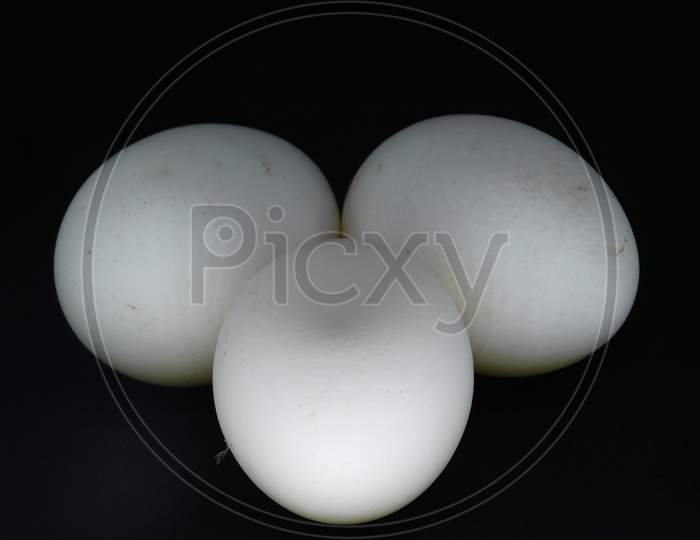 Closeup View Of Eggs Isolated On Black Background