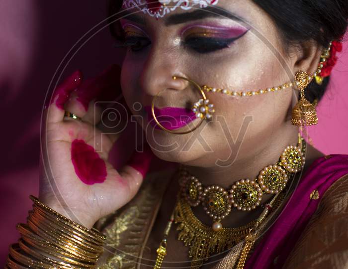 Portrait Of Beautiful Woman With Bright Bridal Makeup And Jewellery