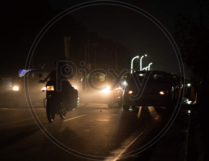Vehicles in night fog on Tankbund