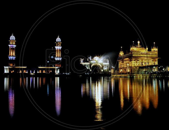 The Golden Temple at night with reflections