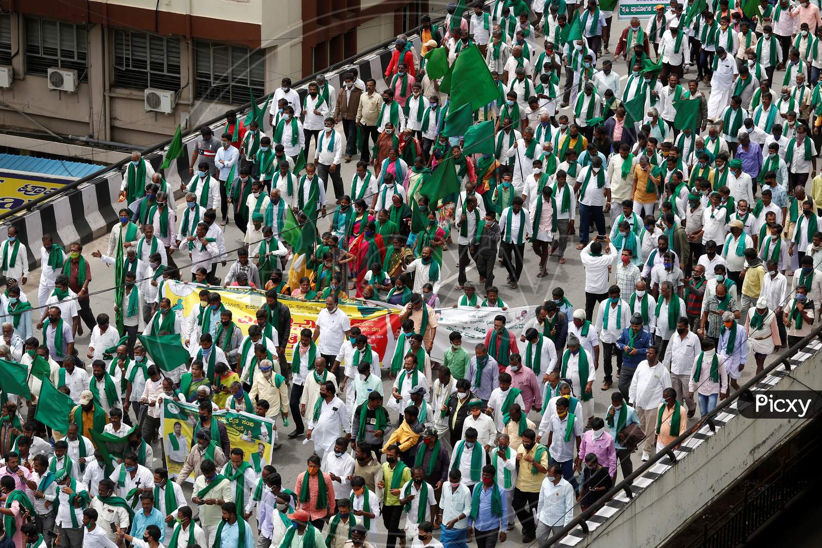 Farmers chant slogans against the government and protest against the passage of two controversial farm bills by the country’s parliament in Bangalore, India.