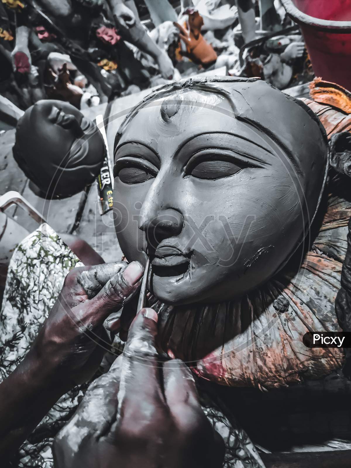 Craftsman is working on the face of Goddess Durga's Idol during pandemic , Kolkata, India, October 12, 2020