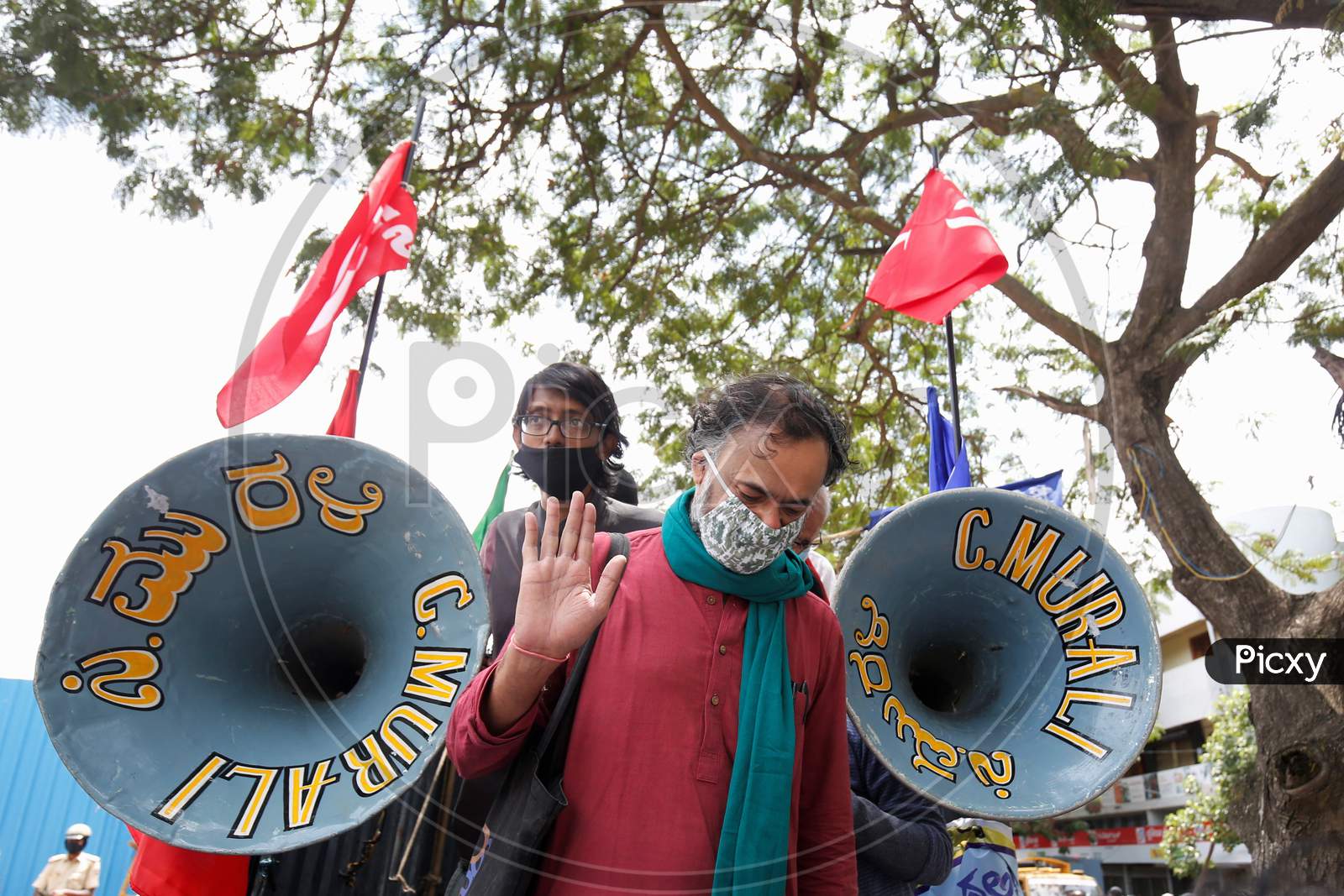 Yogendra Yadav, national President of Swaraj Abhiyan and political activist greets his supporters as he arrives to participate in a protest against the passage of two controversial farm bills by the country’s parliament in Bangalore, India.