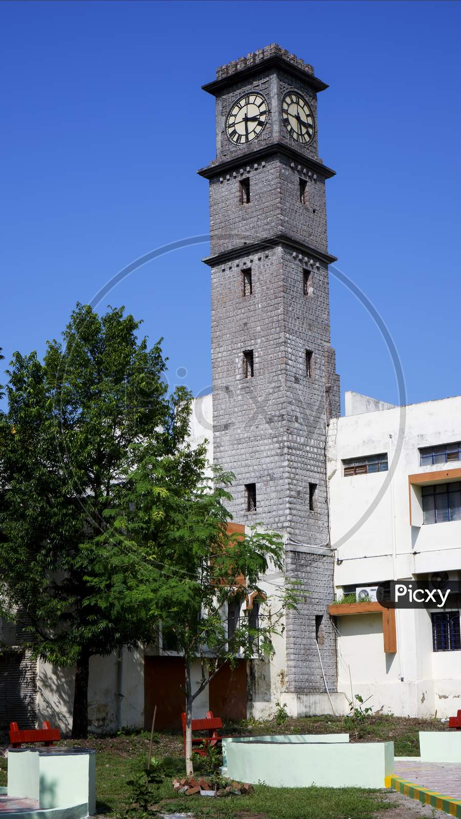 Gulbarga University Library Clock Tower Isolated In Blue Sky