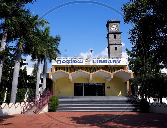 Kalaburagi, Karnalow Angle View Of Gulbarga University Library Building Isolated In Blue Sky
