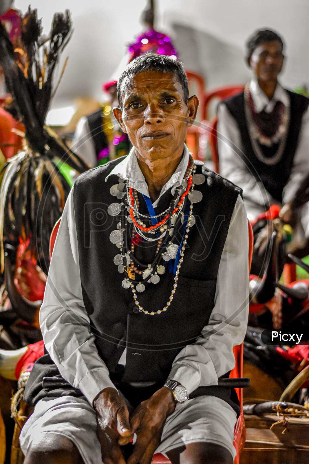 Man with tribal ornaments ready for Dandami Madiya Dance.