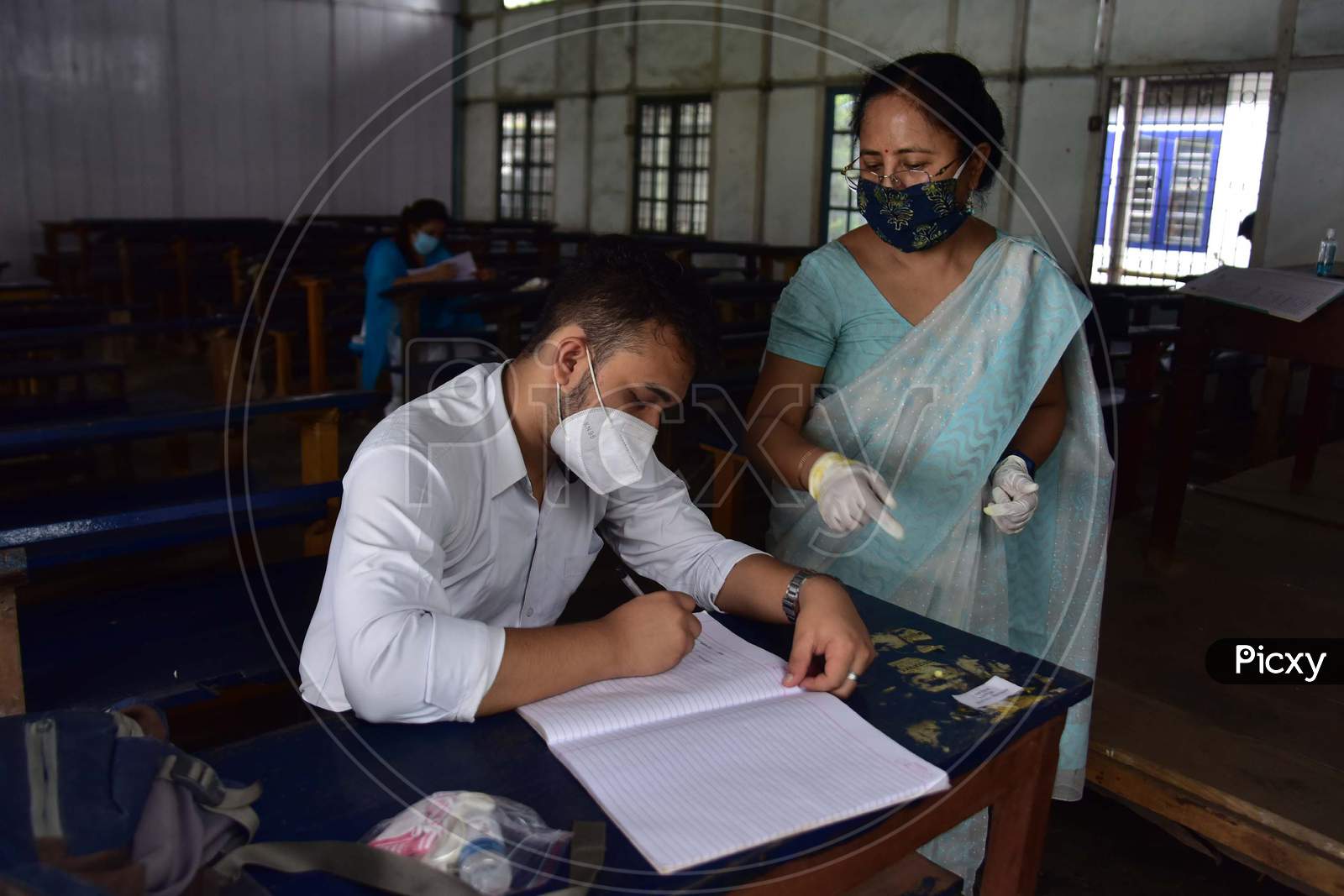 Students maintain social distancing as they attend a class after schools and colleges reopened after more than 5-months closure due to the Covid-19 coronavirus pandemic in  Nagaon District of Assam on Sep 21,2020.