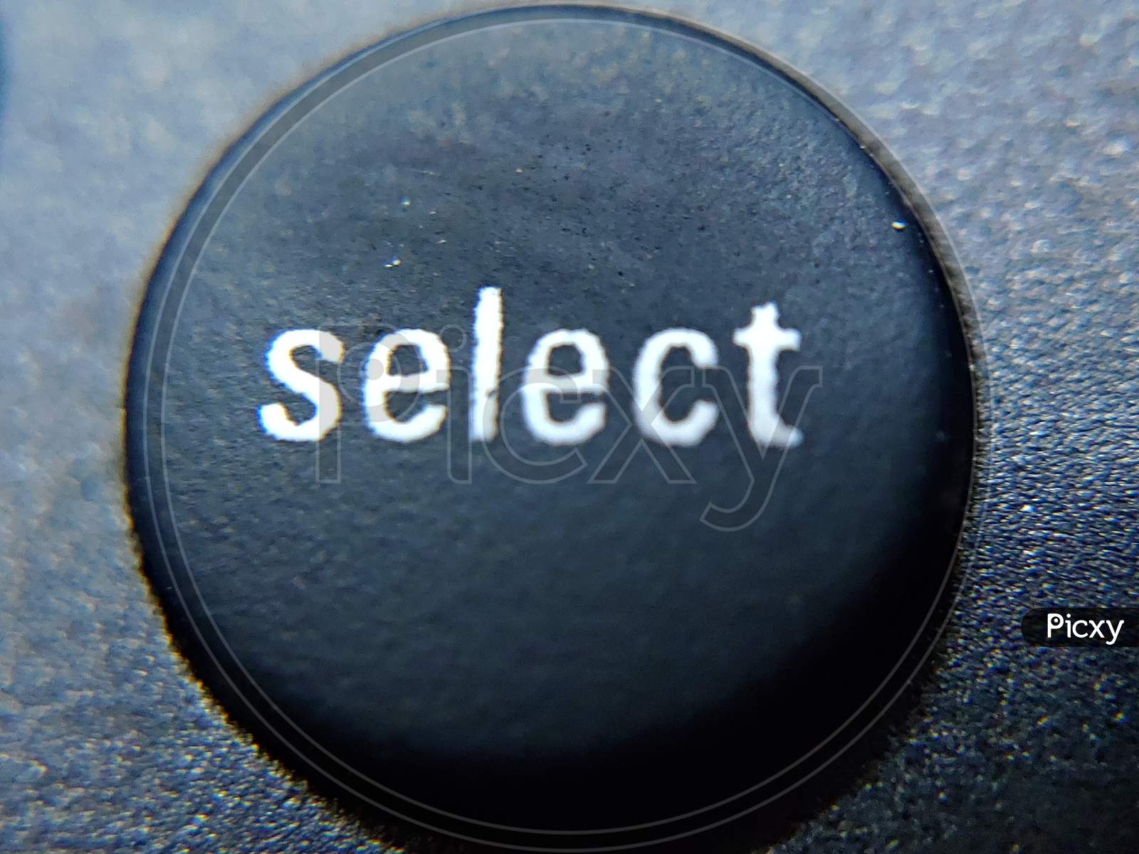 Select button on a TV remote