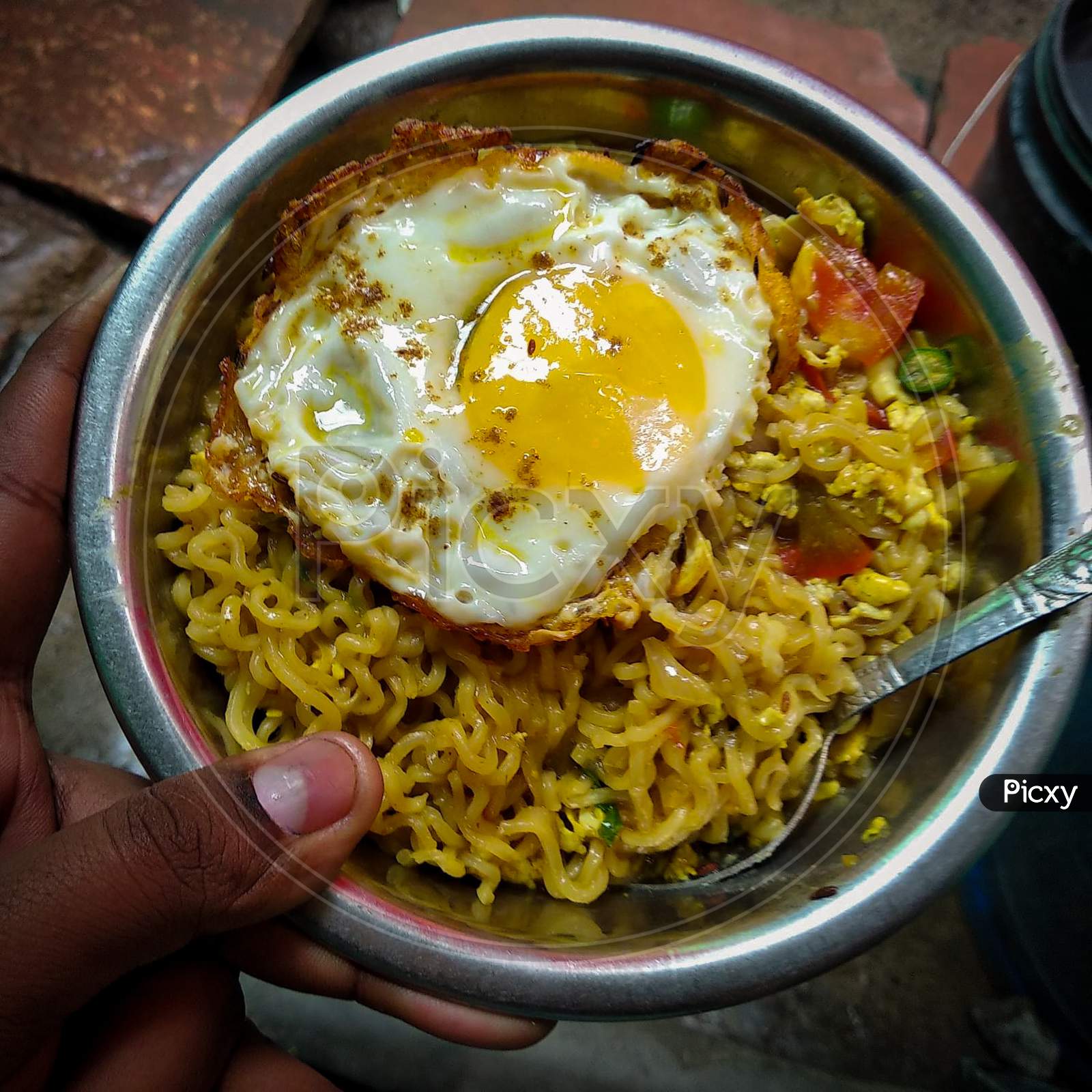 Maggie noodles with half fried egg