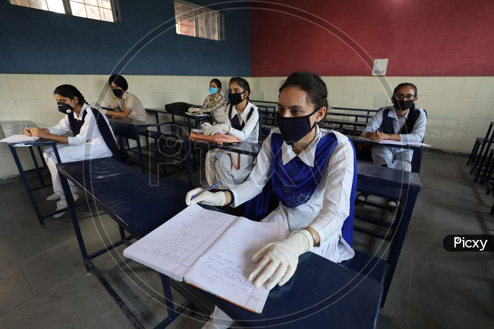 Students attend their school in Jammu on 21 September,2020. The schools across Jammu region partially reopened for 9th to 12th classes after six months closure due to the outbreak of Coronavirus pandemic.