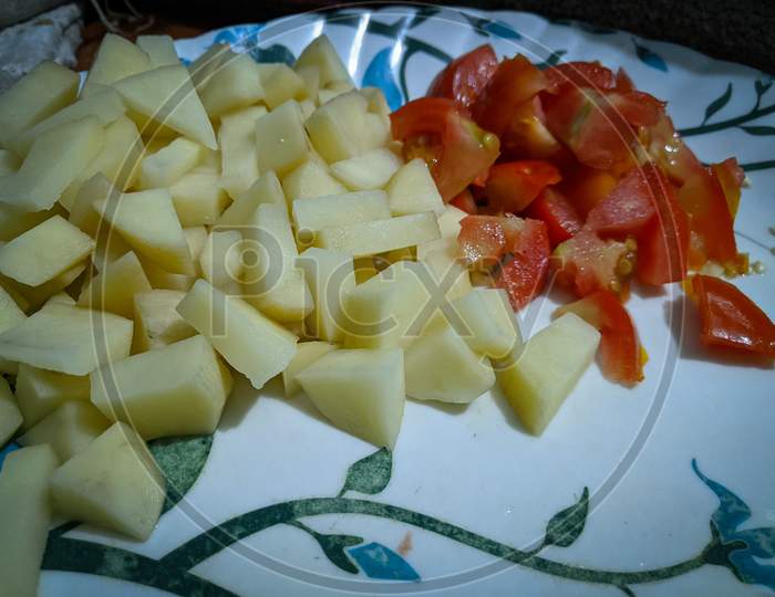 Pieces of potato and tomato