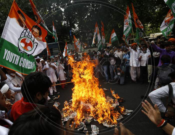 Member of India's opposition Congress party shout slogans during a protest against agriculture bills in New Delhi, India, Sept  22, 2020. Amid an uproar in Parliament, Indian lawmakers  approved a controversial agriculture bills that the government says will boost growth in  farming.