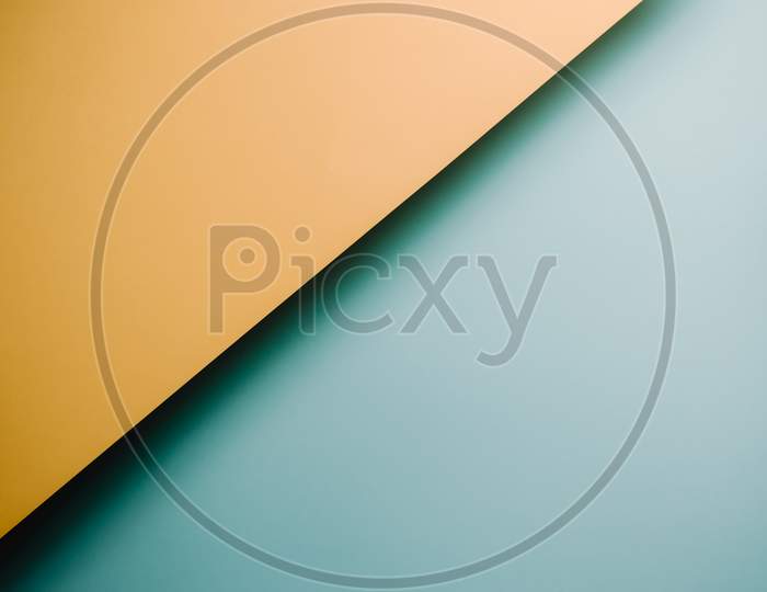 Yellow And Blue Pastel Flat Lay Background With Sharp Layers And Shadows With Copy Space