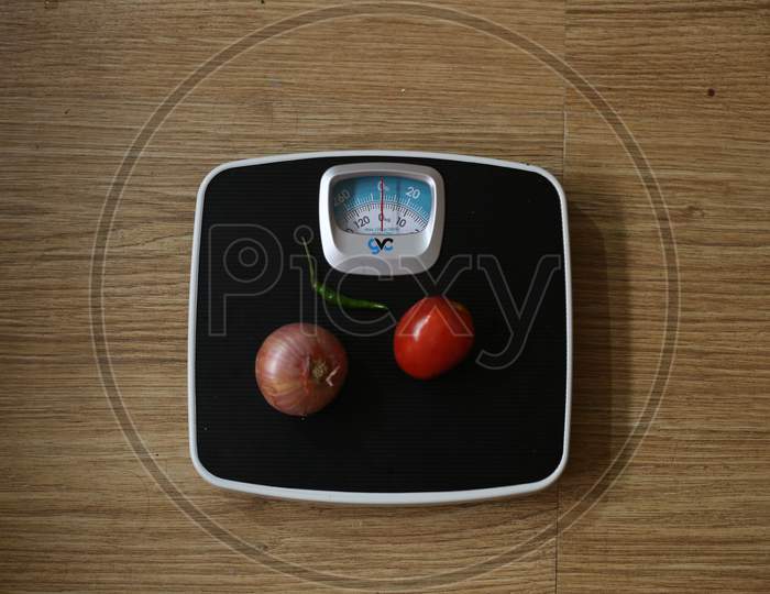 Weight Machine Concept, Vegetables On The Weight Machine