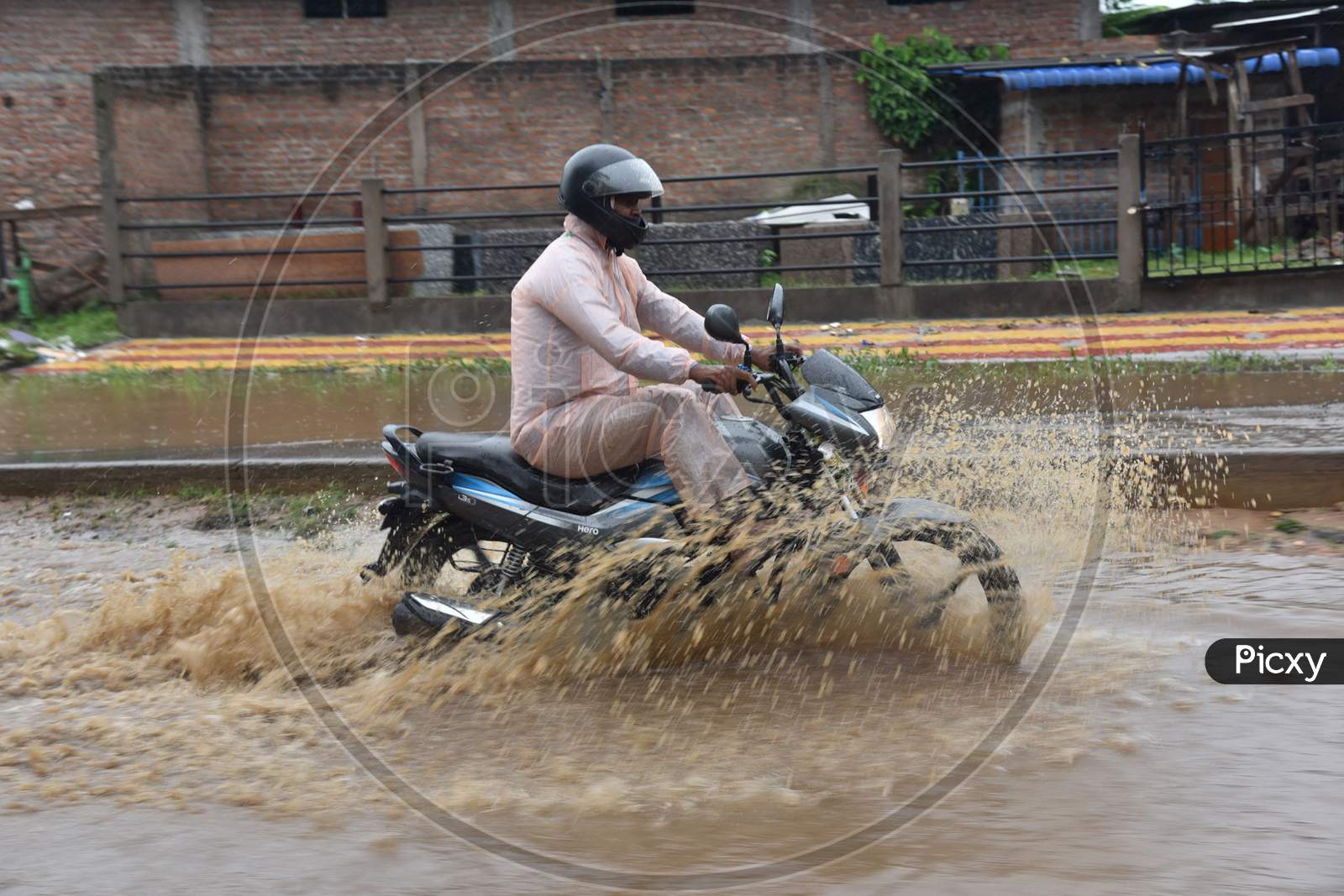 A biker wades through a waterlogged street following heavy rainfall, at Boragaon in Guwahati on Tuesday, Sept. 22, 2020.