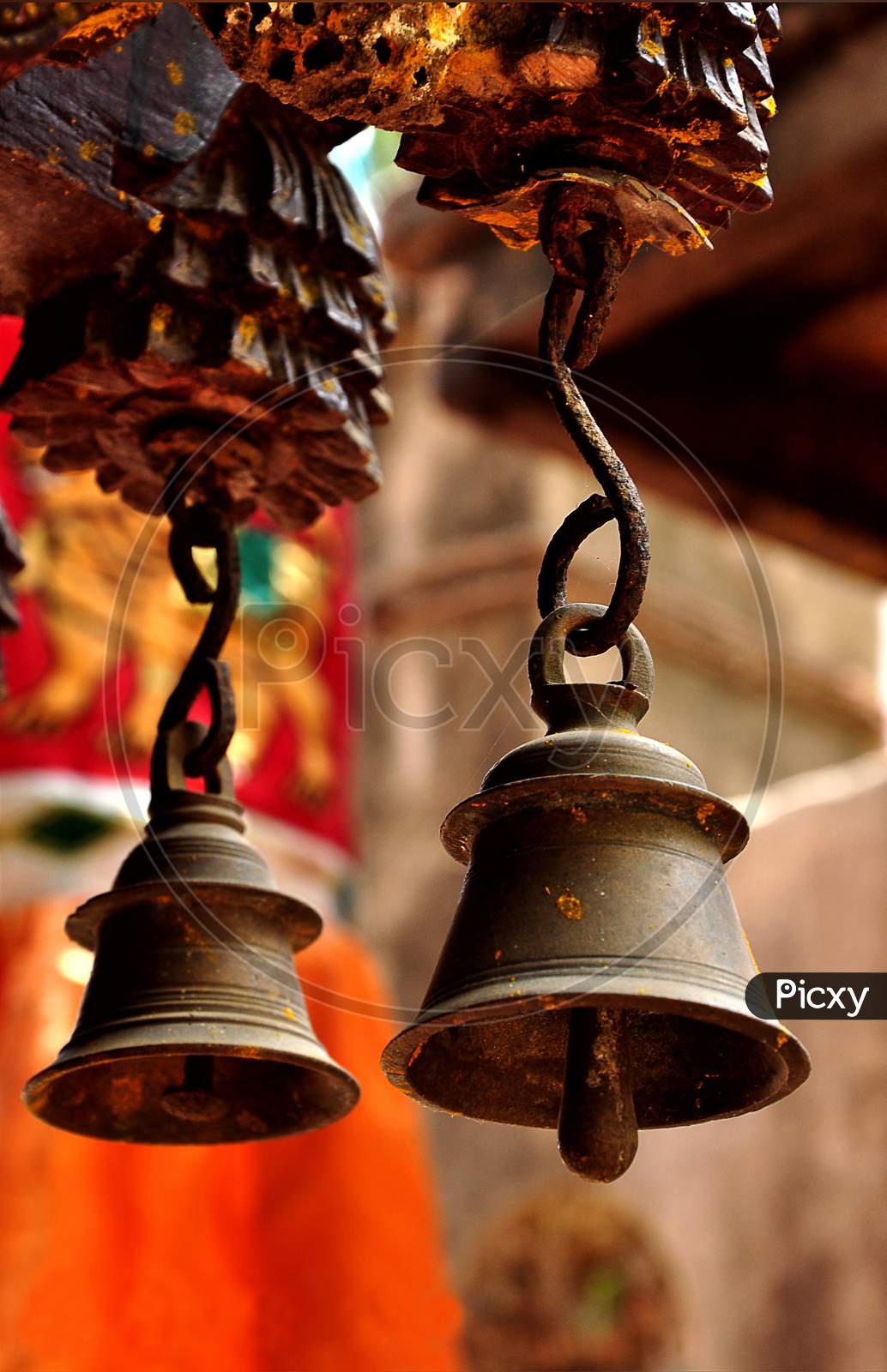 Two ancient type bells hanging in a temple