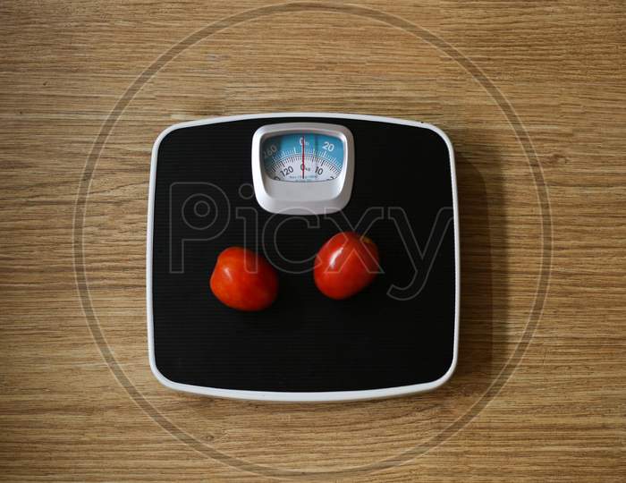 Weight Machine Concept, Tomato On The Weight Machine