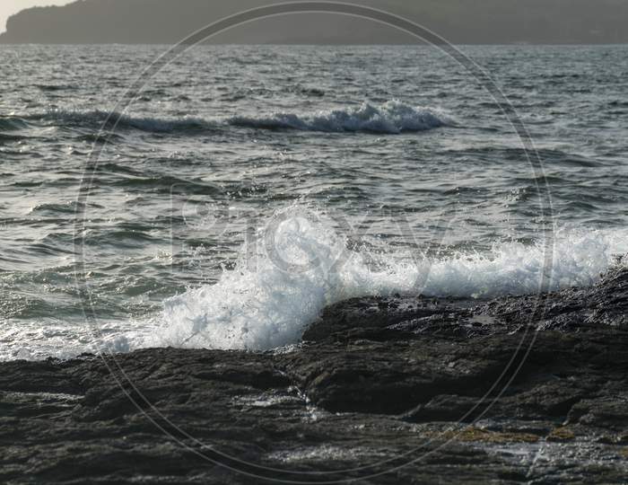Panoramic View Of Sea Waves Crashing On Rocks At Velneshwar Beach In India