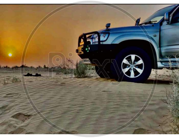 Jeep in Desert and sunset view