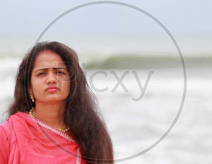 A Beautiful South Indian Model Poses On Chennai'S Merina Coast And Defocused Towards Hind Ocean Natural Background