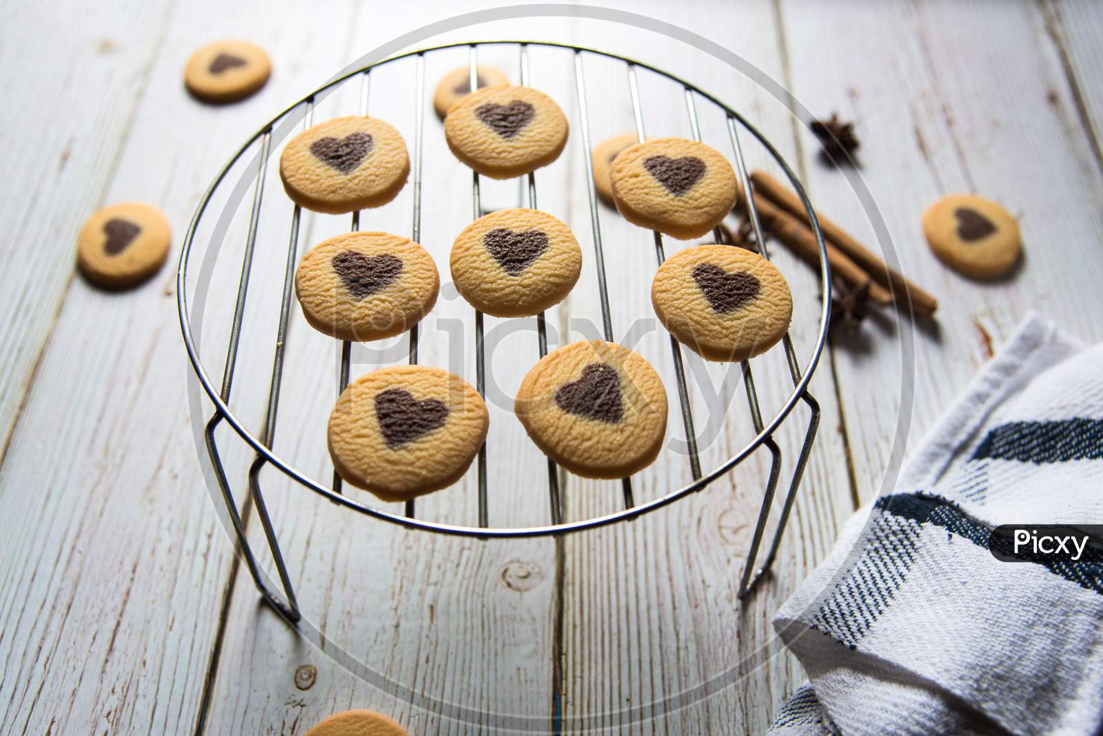 Close up of heart shaped cookies arranged on a grill stand
