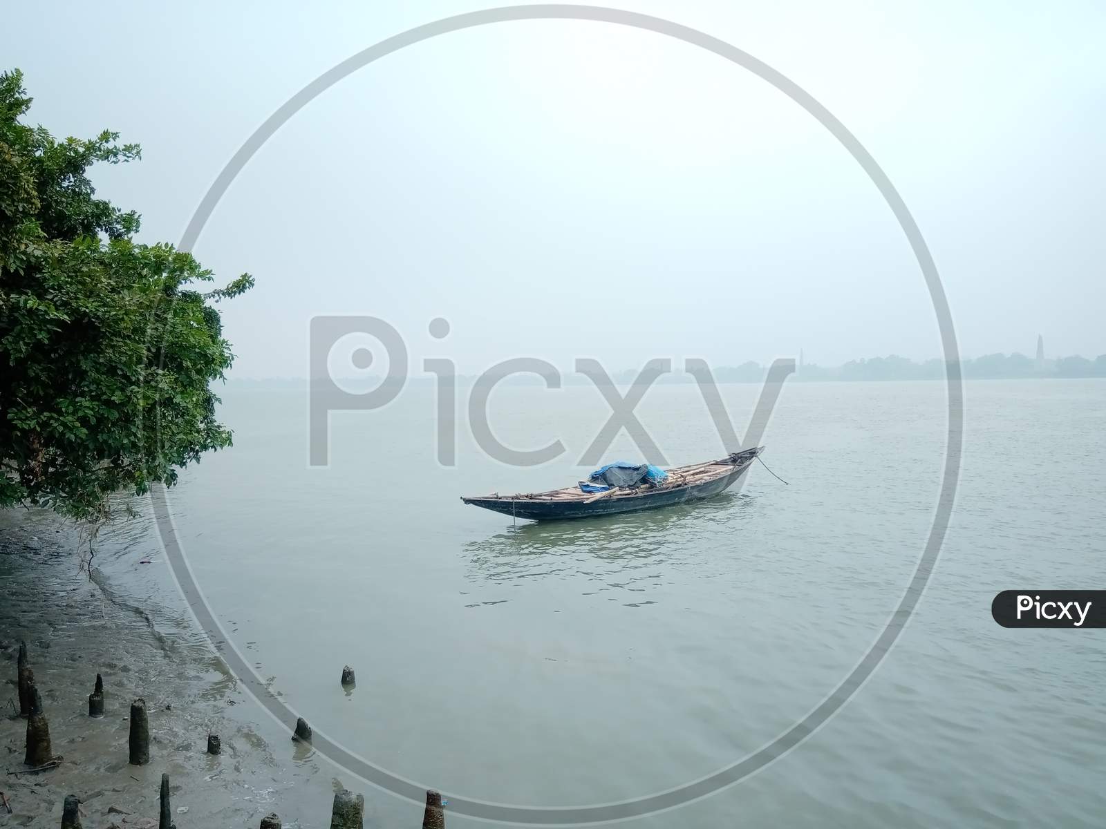 Boating on the river in a foggy morning
