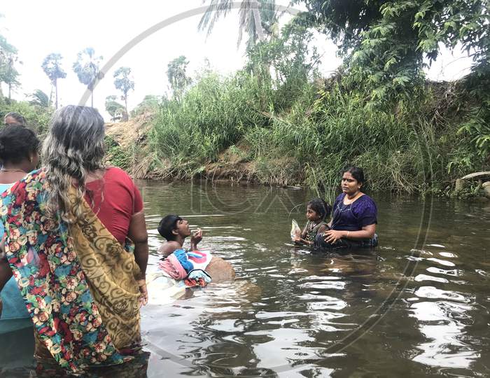 People From Family Altogether Enjoying The Natural Water Source In An Indian Forest And Enjoying Their Vacation Or Holiday