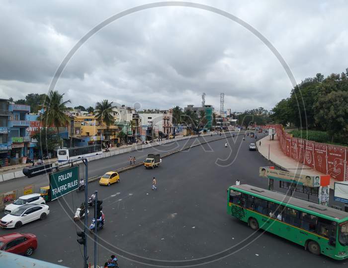 Closeup of View From Sumanahalli bridge of Four Lane and BMTC Bus Stop with Heavy Traffic at Sumanahalli to Sunkadakatte Road