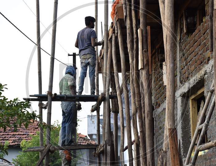 Workers Making Roof Of The House