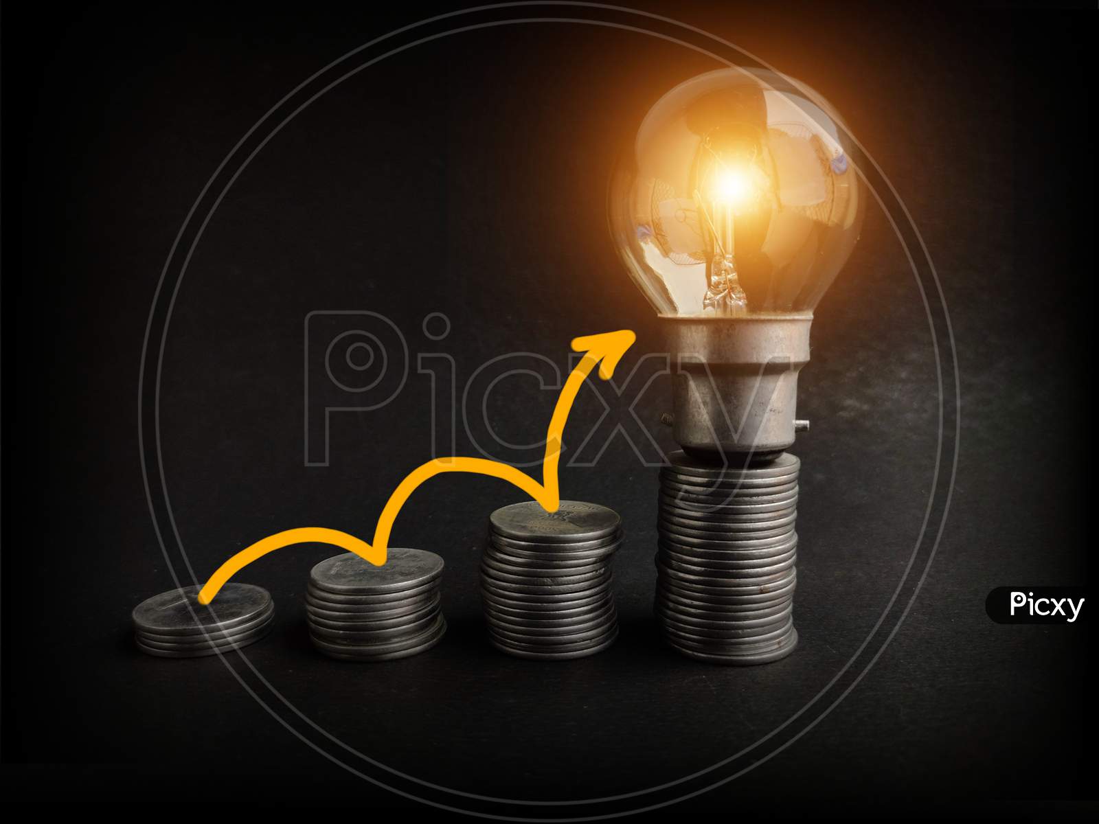 light bulb with coins stack. Creative ideas for saving money concept. Money management for the future, energy saving