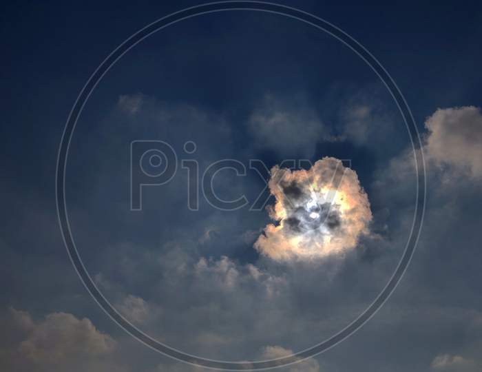 Sun behind a cloud
