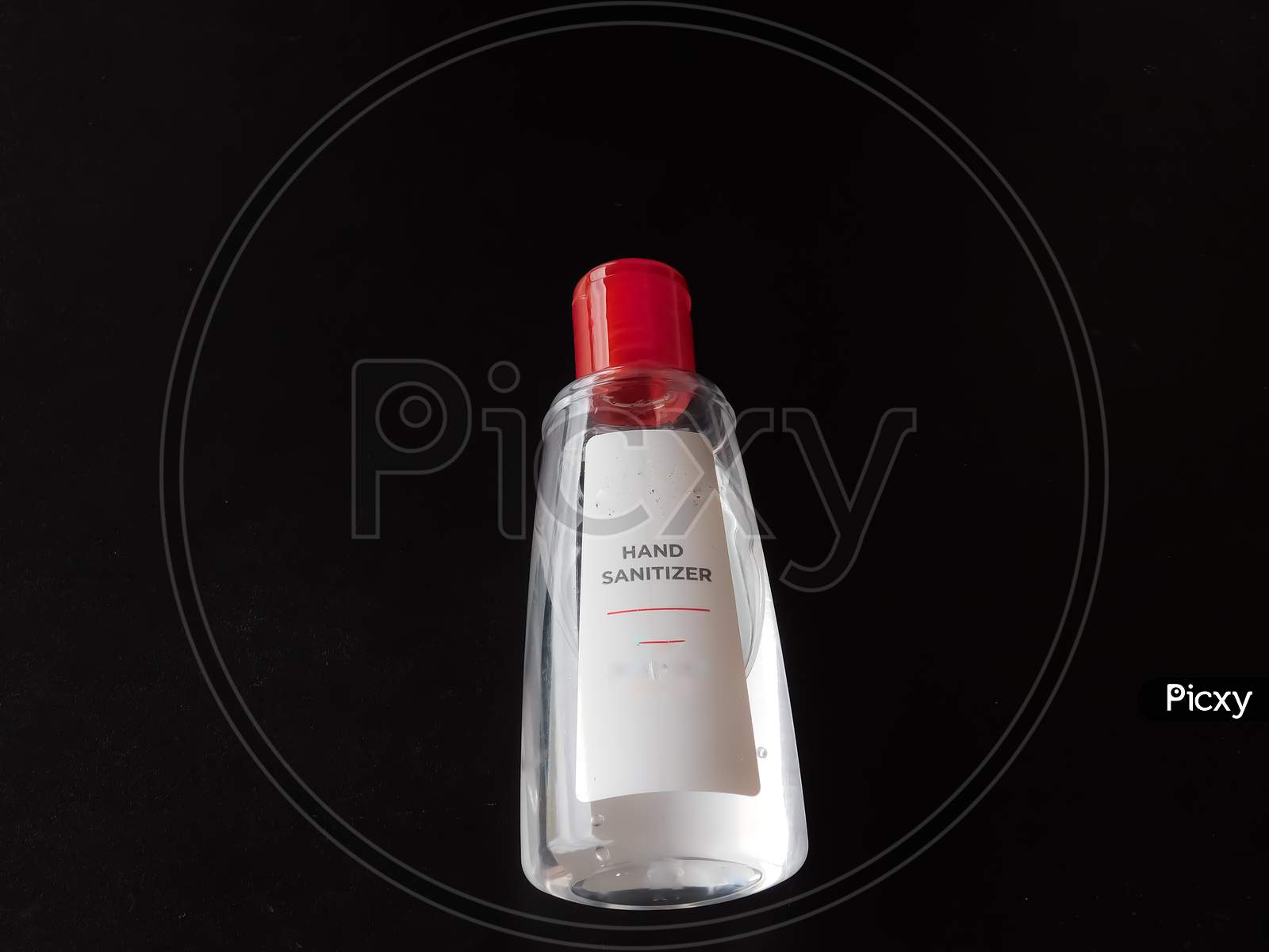 Closeup Of A Hand Sanitizer Bottle Isolated On Black Background