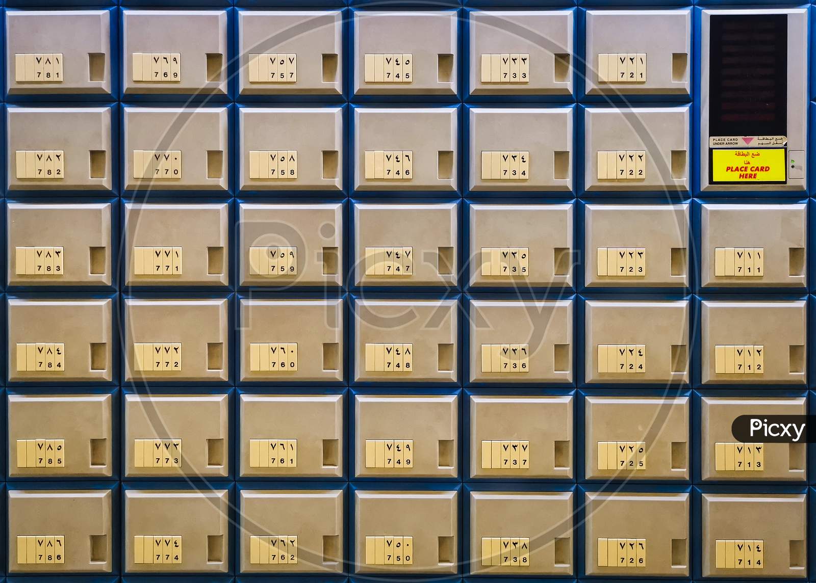 Multiple rows of golden post office boxes