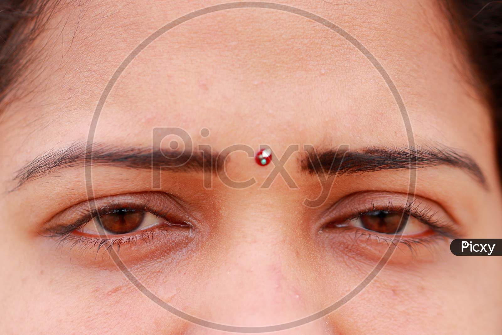The Tears Of Tears Flow From The Cute Eyes Of The South Indian Lady Model.
