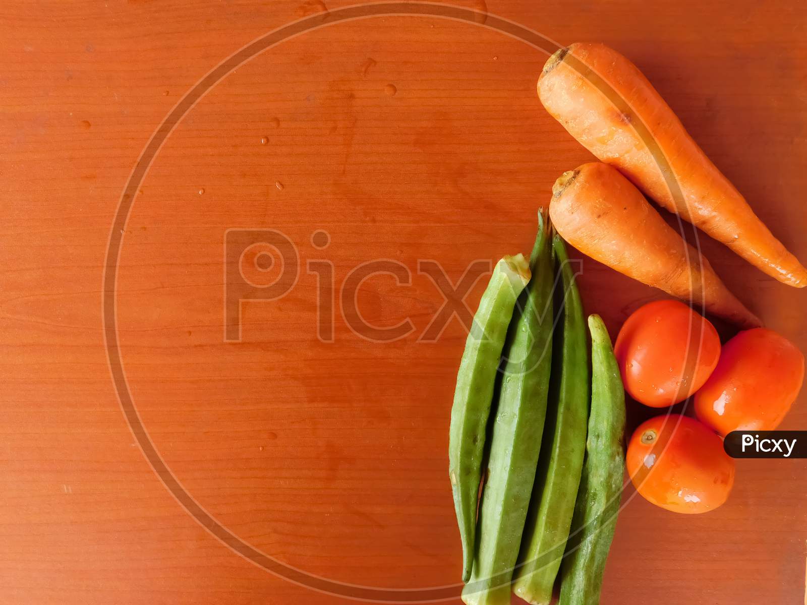 Closeup Of Vegetables Isolated On A Wooden Surface