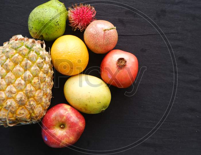 mixed fruits on black background ,close up view