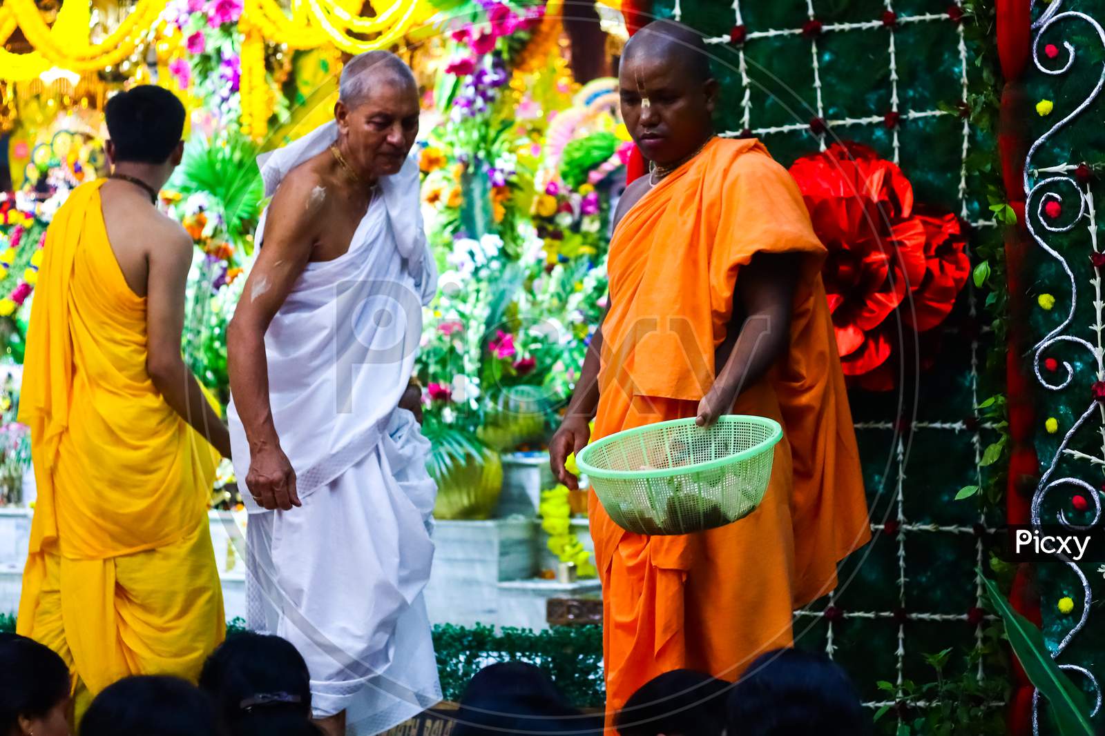 August 15Th, 2020, Iskon Temple, Krishnanagar, Nadia West Bengal. Monks Collect Offerings From Devotees In A Basket After Evening Puja At Krishna Temple, Iskon.