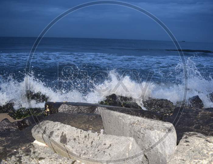 Waves hitting rock in Pondicherry rock beach