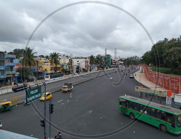 Closeup of View From Sumanahalli bridge of Four Lane and BMTC Bus Stop with Heavy Traffic at Sumanahalli to Sunkadakatte Road