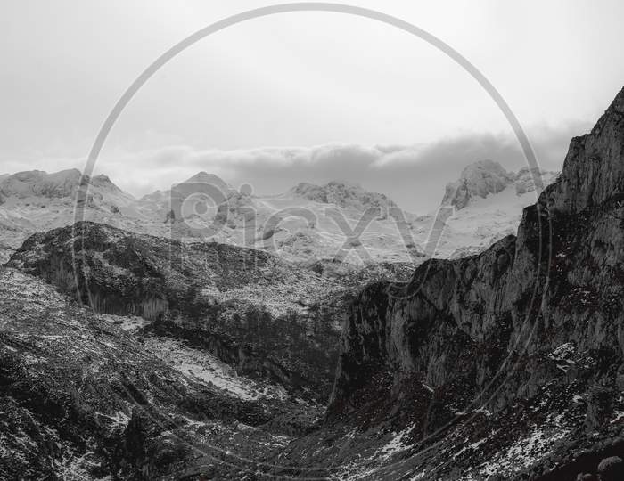 A Close Up Of The Mountain Range During Winter With Snow And Copy Space In Black And White