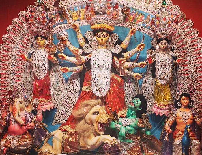 Durga idol with family during Durga Puja