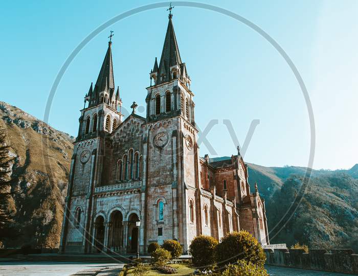 A Colorful Shot Of The Cathedral Of Covadonga During A Clear And Sunny Day