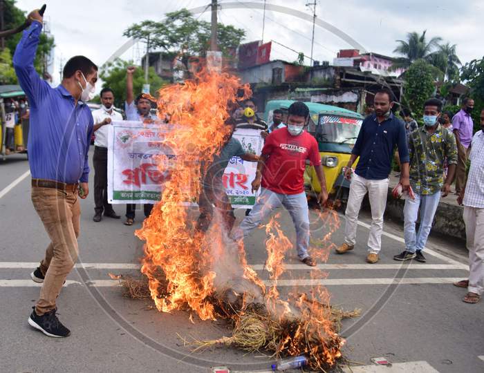 Asom Jatiyatabadi Yuba Chatra Parishad (AJYCP) activists burn effigies of Prime Minister Narendra Modi  during a  a protest against recent  farm bills  in Nagaon District of Assam on Sep 23,2020